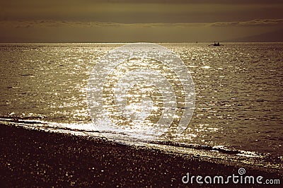 Scenic View Golden Shine Shimmering Of The Evening Sun On Tropical Beach Sea Stock Photo