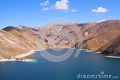 Scenic view of lake high in the mountains Beautiful moss hills, blue water and sky in Chechenia republic Stock Photo