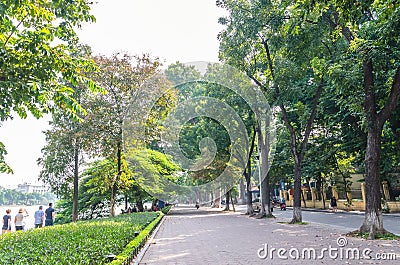 Scenic view of the lakeside of Hoan Kiem Lake, people can seen relaxing and exploring around it. Editorial Stock Photo