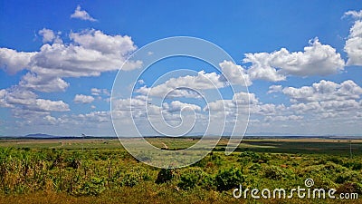 Scenic view of landscape with clouds in sunny day. Stock Photo