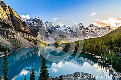 Scenic view of Moraine lake and mountain range at sunset Stock Photo