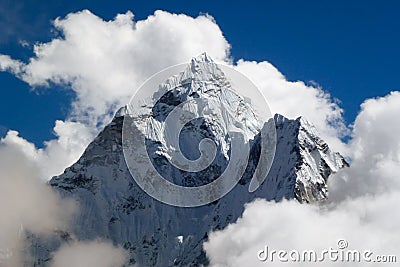 Mount Ama Dablam with big clouds and blue sky, seen from Thok La pass, Everest Base Camp trek, Nepal Stock Photo