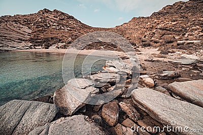 Scenic view of the rocky coast of Paros Island, Greece on a bright sunny day Stock Photo