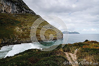 Scenic view of rocky promontory in the coast. Sonabia Beach in Cantabria Stock Photo