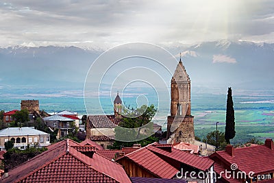 Scenic view on a roofs of ancient buildings of Sighnaghi, Georgia. Alazani Valley and Caucasus mountain range Stock Photo
