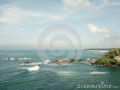 Scenic view of the ocean against blue sky in Galle, Sri Lanka Stock Photo