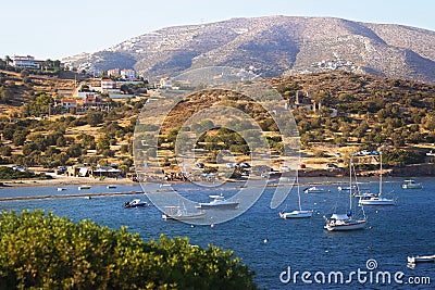 Scenic view of sea bay with boats and beach in background, Anavyssos, Greece Stock Photo