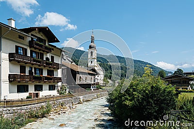 Scenic view of small village and white church in the Alps Stock Photo