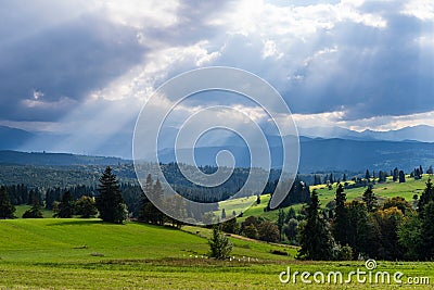 Scenic view of sun rays over mountain landscape. Stock Photo