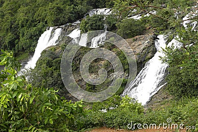 Scenic view of twin waterfalls in mountains Stock Photo