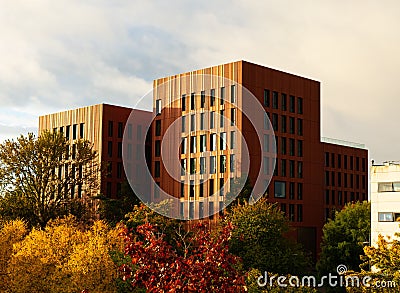 Scenic view of the University of Warwick surrounded by autumn trees during golden sunrise, UK Editorial Stock Photo