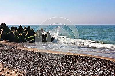 Waves breaking on rocky beach Stock Photo