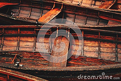 Scenic view of wooden dinghy boats peacefully afloat on the picturesque waters of Lake Bohinj, Slovenia Stock Photo