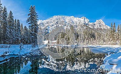 Scenic winter landscape in Bavarian Alps at idyllic lake Hintersee, Germany Stock Photo