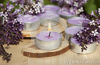 Scented candles on a wooden stand Stock Photo