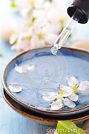 Scented water and flowers. Stock Photo