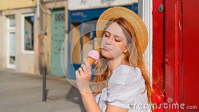 sceptical woman looking on ice cream outdoors Stock Photo