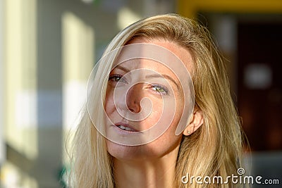 Sceptical woman looking suspiciously at camera Stock Photo