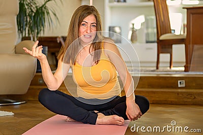 Sceptical woman pulling a wry face and grimace as she looks to the side Stock Photo