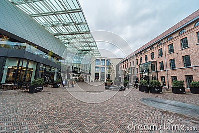Schaerbeek, Brussels - Belgium - Inner court and glass overhang of the docks bruxsel shopping mall during a rainy day Editorial Stock Photo