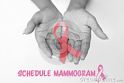 Composite image of schedule mammogram text with breast cancer awareness ribbon Stock Photo