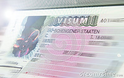 Schengen visa stamp in international passport. Shengen document for pass customs control on border of a country. Document for trav Editorial Stock Photo