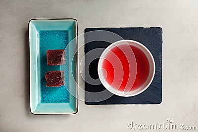 Schizandra tea and fruits marmalade, top view. Traditional ancient Korean drink is brewed from Chinese lemongrass berries. Used Stock Photo