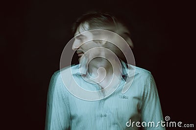 schizophrenic portrait of a psychopathic man with mental disorders in a white shirt Stock Photo