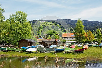 Schlierach river, boathouses and colorful boats Stock Photo