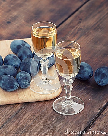 Schnapps and plums Stock Photo