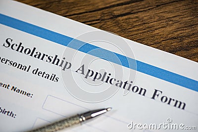 Scholarship application form document contract concept with pen for grants education Stock Photo