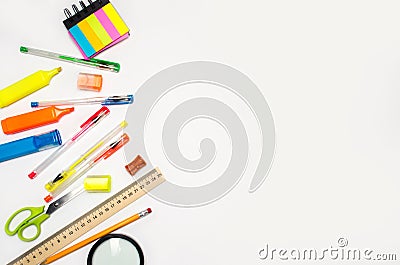 School accessories on a white background. stationery. back to school. concept of education. desk. color pens, pencils, ruler, alar Stock Photo