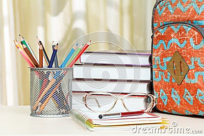 School backpack with school supplies. Books, metal stand for pen Stock Photo