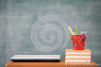 School books on desk, school supplies. Books and blackboard background, Online education, education concept Stock Photo