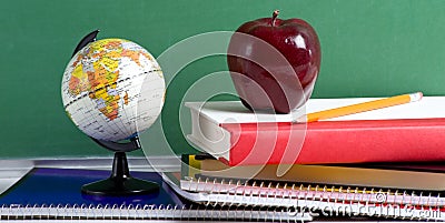 School Books a red Apple and a Globe Stock Photo