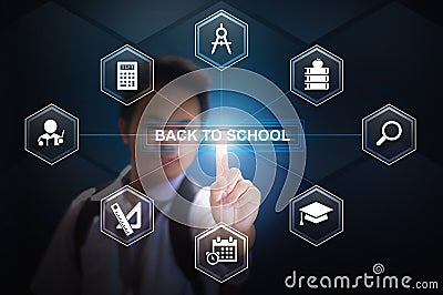 School boy touching Back to school button using Virtual Screen Hologram Stock Photo