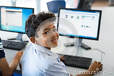 School boy using computer Stock Photo