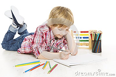 School boy writing exercise in notebook. Schoolboy do homework Stock Photo