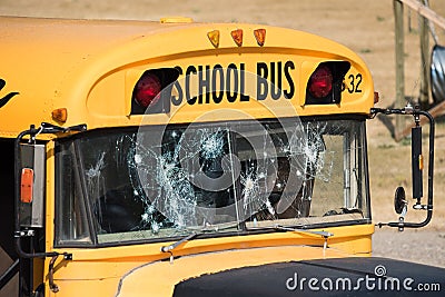 School Bus Shot Up With Bullet Holes After Shooting Stock Photo