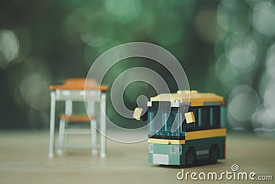 School bus toy and student table Stock Photo