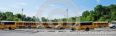 School buses parked in a parking lot at White Plains, NY 2 Editorial Stock Photo