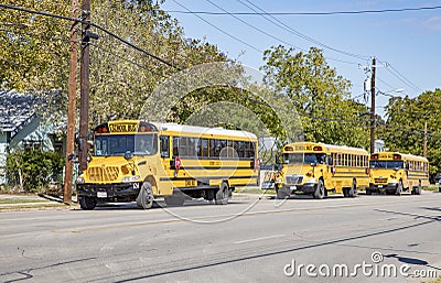 school busses on the way in Boerne, Texas, USA. School busses are free for pupils in the USA Editorial Stock Photo