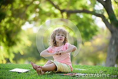 School child pupil learning in the park. Stock Photo