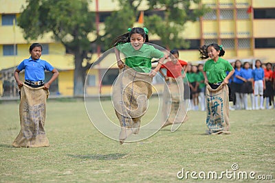 School children competing in sack race Editorial Stock Photo