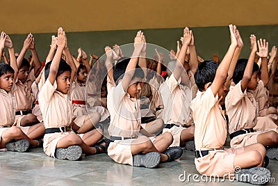 School children doing yoga with the teachers Editorial Stock Photo
