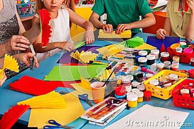 School children with scissors in kids hands cutting paper . Stock Photo