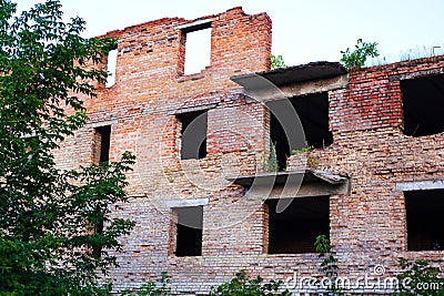 A school in the Donbass fired upon and destroyed by heavy weapons and damaged by an explosion of a red brick building Stock Photo