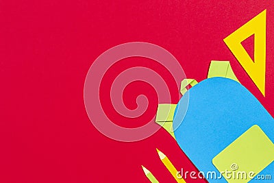 School education papercut background. School bag backpack, books notebooks school supplies paper cut on red background Stock Photo