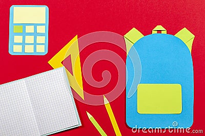 School education papercut background. School bag backpack, books notebooks school supplies paper cut on red background Stock Photo