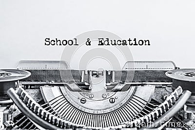 School and education text typed on a vintage typewriter, Stock Photo